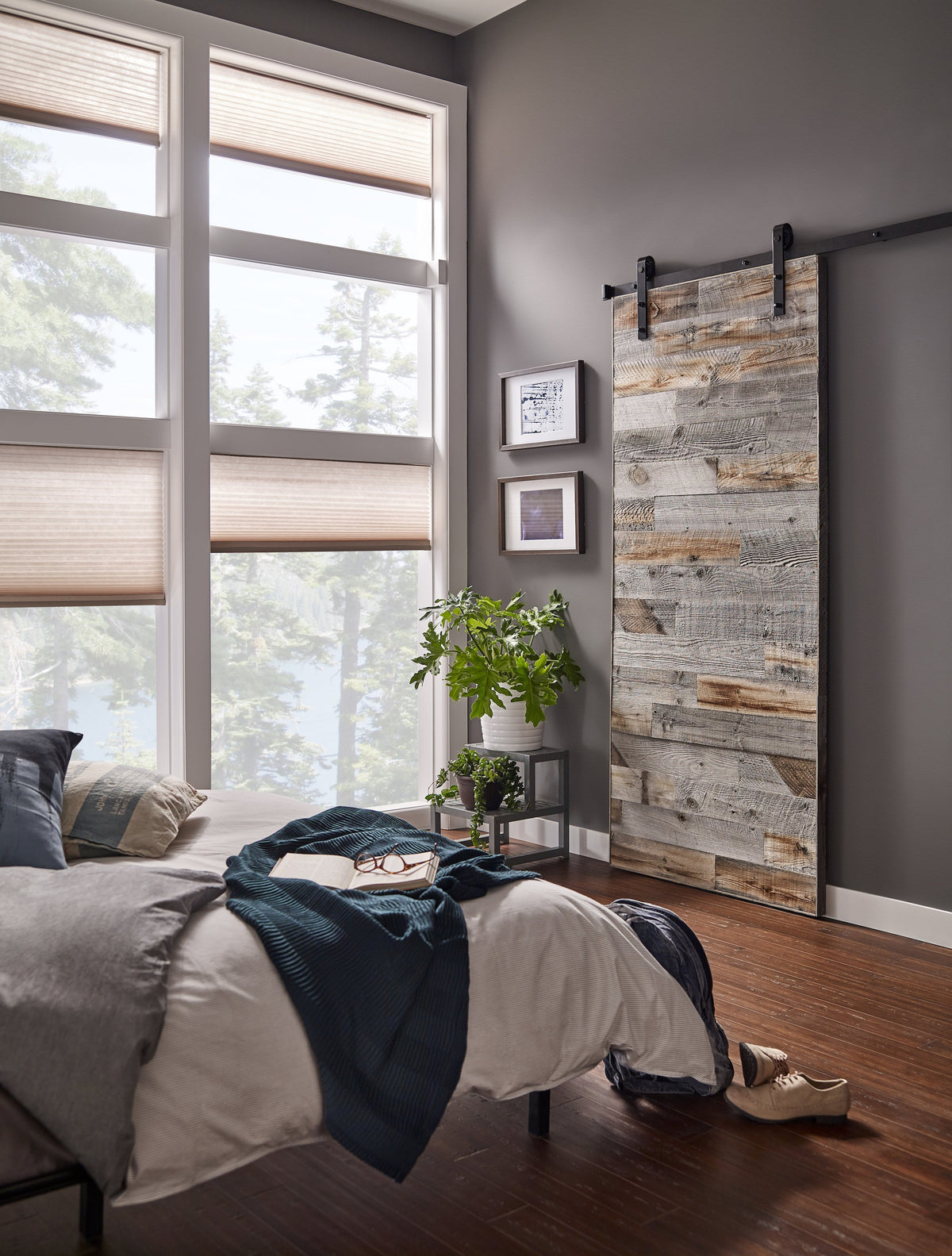 Stikits Interior Barn Door featuring real wood planks with natural aged character in a cozy modern bedroom.